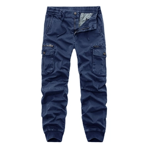 Detail of navy blue cargo pants featuring elastic drawstring waist and multi-pocket design