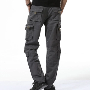 Mens dark grey tactical cargo pants with multiple pockets and loose fit in studio shot