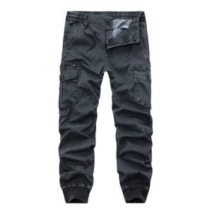 Detail of dark grey cargo jogger pants featuring multi-pockets and elastic drawstring waist