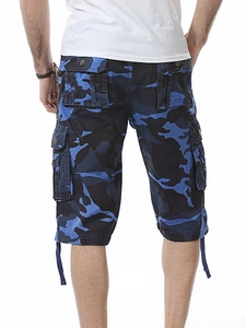 Detail view of cargo pockets and blue camo pattern on men's cotton outdoor shorts