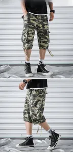 Detail of cargo pockets and drawstring cuffs on camouflage loose summer shorts