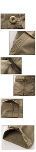 Detail view of khaki cargo pants showing reinforced stitching, pockets, and metal zipper
