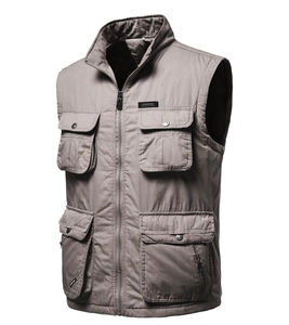 Detail of khaki outdoor utility vest with functional multi-pockets and secure zipper closure