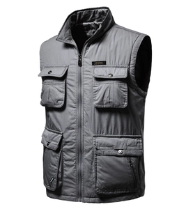 Detail of grey multi-pocket tactical cargo vest featuring durable fabric and chest embroidery