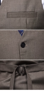 Macro details of brown vest showing twill fabric, resin buttons and adjustable back buckle