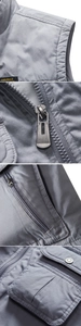 Detailaufnahme der grauen Anglerweste mit Metallreißverschlüssen und Cargotaschen