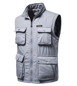 Detail of grey multi-pocket tactical vest showing standing collar and zip closure