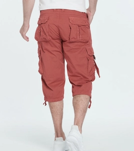 Rear view of brick red cargo capris with large side pockets and drawstring hem details