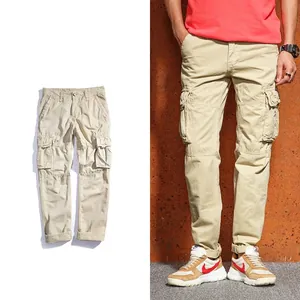 Detail of khaki cargo pants for men featuring large utility pockets and durable fabric