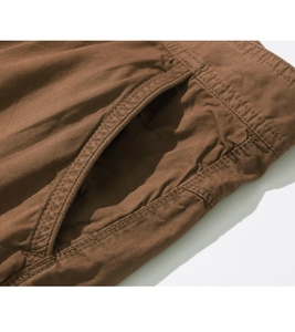 Detailed close-up showing reinforced stitching and heavy-duty pocket on brown cargo shorts
