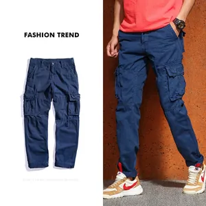 Detail of navy blue cargo pants with multiple pockets and reinforced stitching design