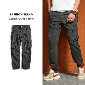 Detail view of charcoal gray multi-pocket cargo pants showing layout and fit on model