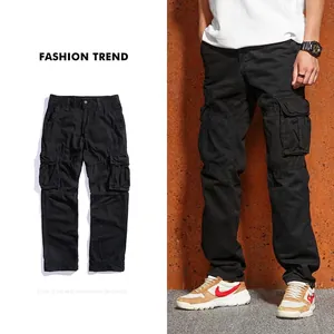 Detail of black cargo pants featuring large side pockets and durable cotton canvas fabric