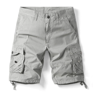 Detail view of light grey cargo shorts featuring durable cotton fabric and side flap pockets