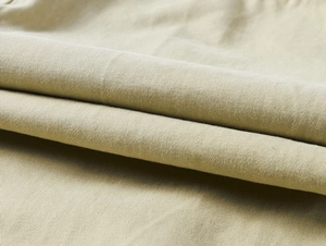 Close-up macro view of durable khaki twill fabric texture for men's cargo pants
