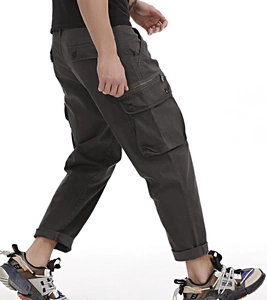 Side view of men's dark grey cargo pants featuring multiple large utility pockets
