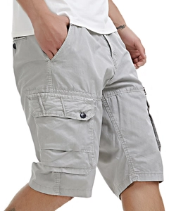Detail of light gray cargo shorts featuring multi-pocket design and reinforced stitching