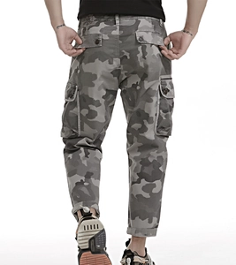 Rear view of camo cargo pants featuring functional large flap pockets and durable cotton fabric