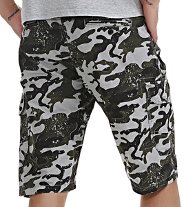 Detail of cargo camouflage shorts featuring side flap pockets and reinforced stitching