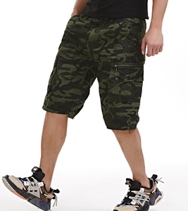 Detail of men's loose cargo shorts featuring jungle camouflage print and side zipper pockets