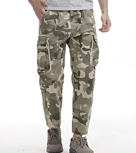 Detail of men's cargo pants featuring woodland camouflage pattern and 3D utility pockets