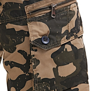 Detail shot of camo cargo shorts featuring a metal zipper and buttoned flap pocket