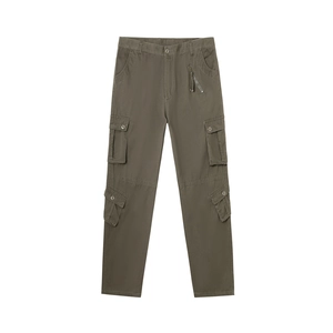 Detail of army green cargo pants featuring 3D utility pockets and durable stitching