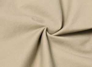 Close-up of khaki combed twill cotton fabric with durable woven texture for cargo pants