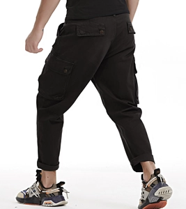Detail view of mens dark brown camouflage cargo pants with functional utility pockets