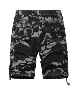 Detail view of urban camouflage cargo shorts with large flap pockets and drawstring hem