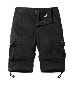 Detail of black cargo shorts with large flap pockets and adjustable drawstring leg openings