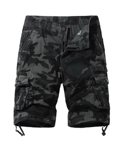 Detail of cargo shorts showing camo pattern, large utility pockets, and adjustable drawstrings