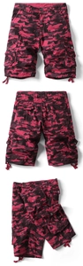 Detail view of red camouflage cargo shorts showing multi-pocket design and drawstring cuffs