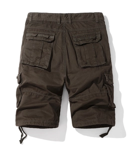 Detail view of dark brown cargo shorts showing heavy canvas texture and flap pockets