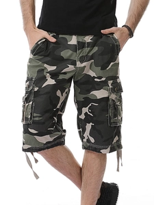 Detail view of cargo side pocket and adjustable drawstring on camouflage shorts