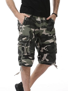 Detail of men's camo cargo shorts featuring multi-pocket design and durable fabric