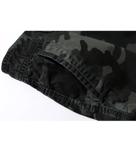 Close-up of camouflage cargo shorts showing double-stitched pockets and durable fabric