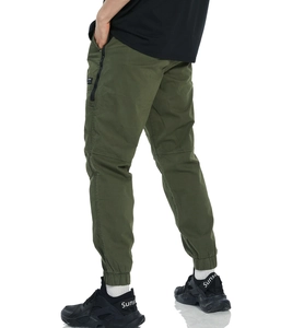 Detail of olive green cargo pants featuring side zipper pockets and elastic cuffs