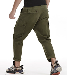 Detail view of army green cargo pants featuring side flap pockets and durable cotton fabric