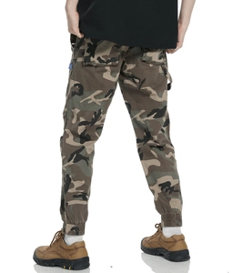 Detailed view of camouflage cargo pants featuring back pockets and elastic ribbed cuffs