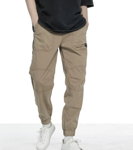 Close-up of khaki cargo joggers featuring multi-pocket design and ribbed cuffs