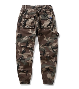 Rear view of camouflage cargo pants with elastic waistband and large flap pockets