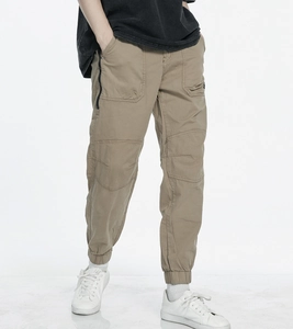 Close-up of khaki cargo jogger pants featuring multi-pocket design and elastic cuffs