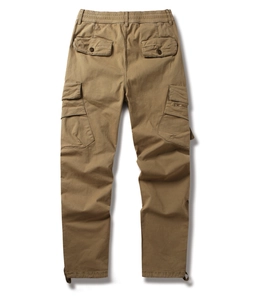Detail of khaki cargo pants featuring elastic drawstring waist and durable pocket stitching