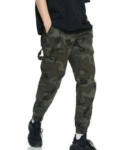 Detail view of cargo pants with camouflage pattern and ribbed ankle cuffs for men