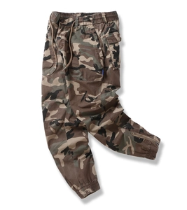 Detail view of camouflage cargo pants with elastic drawstring waist and side metal zipper pocket