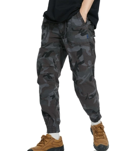 Detail of cargo pants showing side pockets with dark camo pattern and reinforced stitching