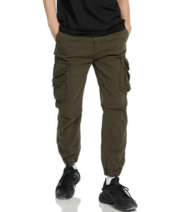 Close-up of deep army green cargo joggers featuring large side flap pockets and ribbed cuffs