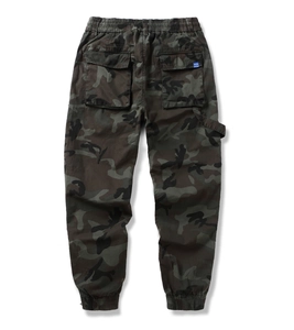 Detail view of camouflage cargo jogger featuring elastic waist and utility back pockets
