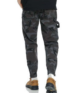 Rear view of camouflage cargo pants featuring back pockets, utility loop and zippered cuffs